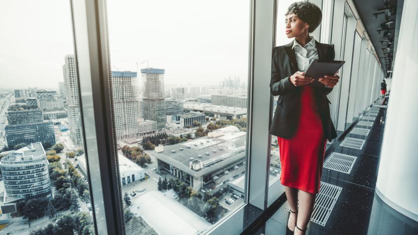 Leigh Howes - Business woman looking out of office window